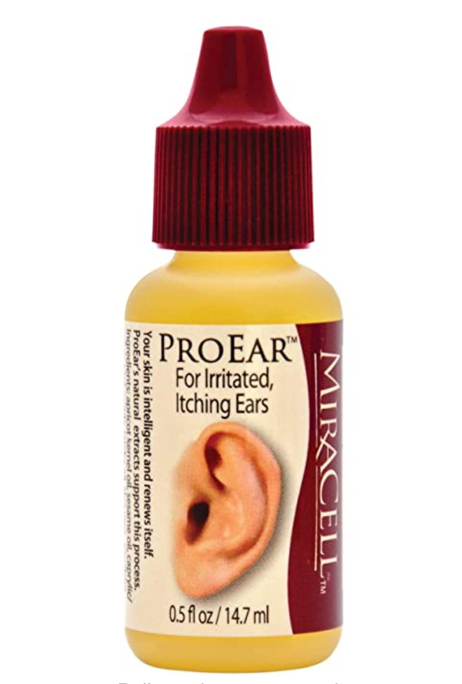 Placing drops of Oil in ear for clearing Wax - Hearing Aids - Hearing